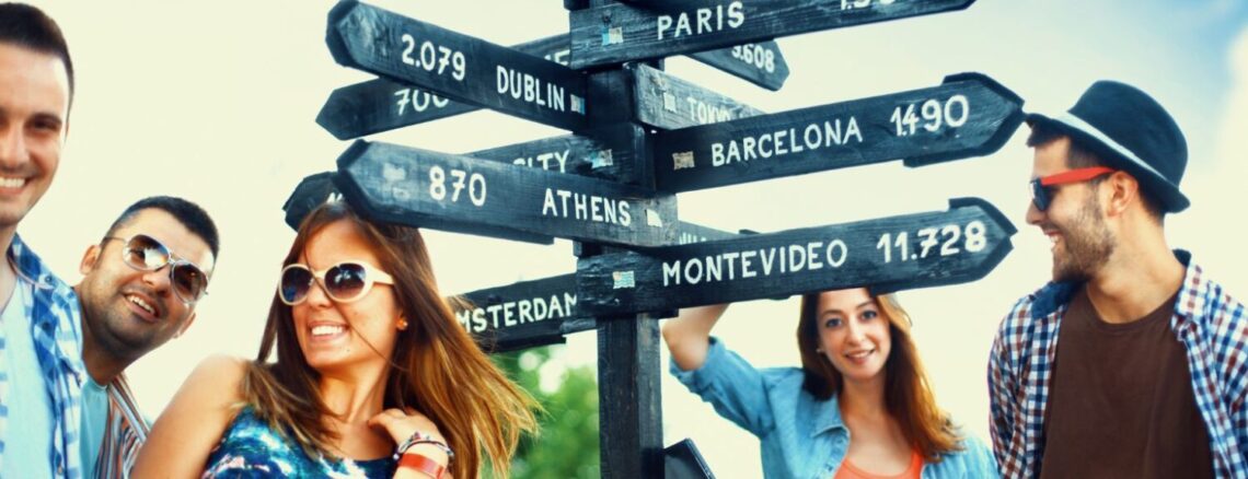 people in front of a sign with destinations